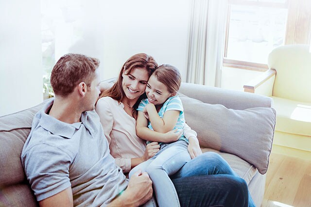 Happy family on sofa